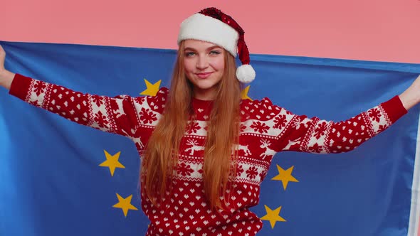 Girl in Christmas Sweater Waving European Union Flag Smiling Cheering Democratic Laws Human Rights