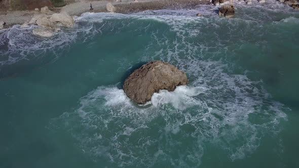 Aerial View of Crashing Waves on Rocks