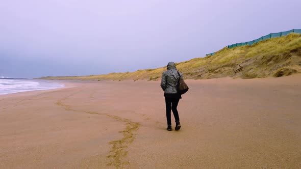 Lady Walking Backwards During the Sandstorm