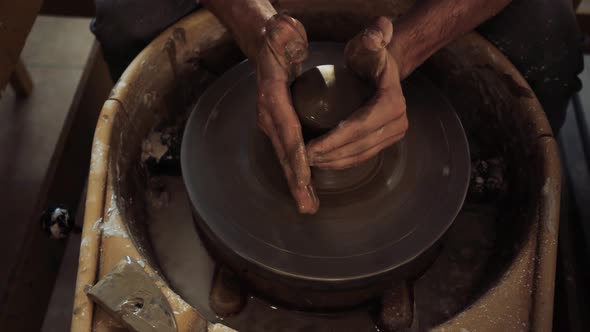 Preparation of a Fresh Piece of Clay for Subsequent Work on the Potter's Wheel
