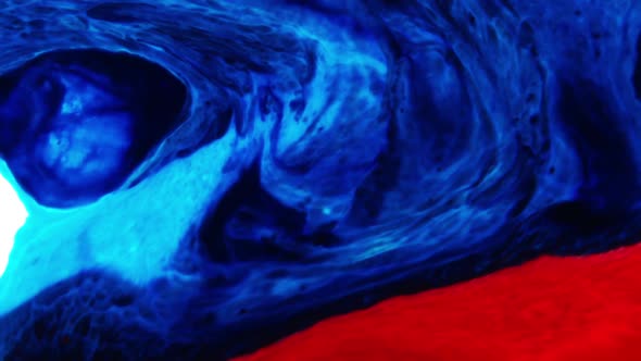 Red And Blue Color Swirling Paint alt