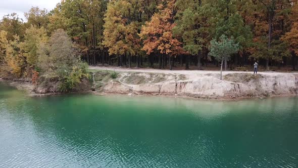 Man taking pictures. Aerial view of man taking photo of nature landscape