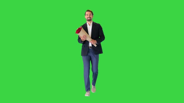 Handsome Man Walking To the Date with Bouquet of Roses on a Green Screen Chroma Key