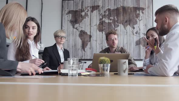 Group of Young People Are Discussing Something in a Modern Office