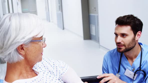 Nurse having a conversation with female senior patient