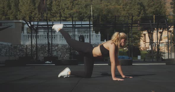 Athlete Exercising Hips In Outdoor Gym