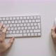 Male Hands Typing on a White Computer Keyboard - VideoHive Item for Sale
