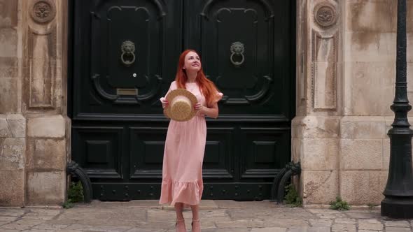 Young Female Tourist Examines Streets of Old City in Italy Close Up