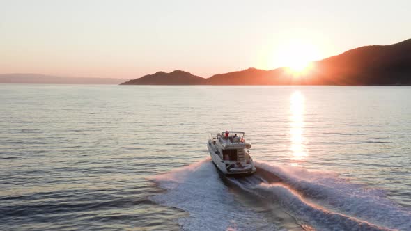 Fast moving motor yacht at the sea.