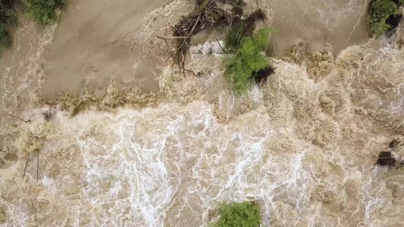 Aerial View of Wide Dirty River with Muddy Water in Flooding Period During Heavy Rains in Spring