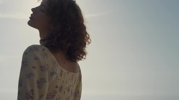 Beautiful Lady Enjoy Sunshine Standing on Sea Beach Close Up