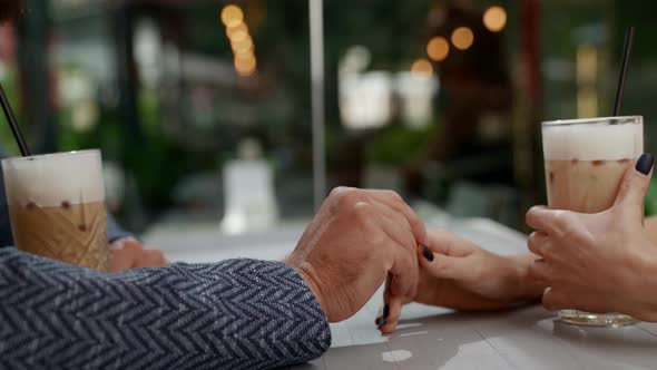 Hands of Lovers During Date in Coffee Shop Closeup View Romantic and Love