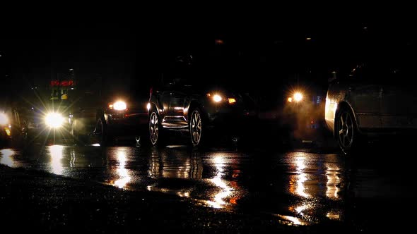 Cars Queuing On Rainy Night