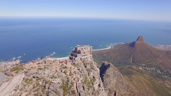 Aerial travel drone view of Cape Town from the top of Table Mountain, South Africa.