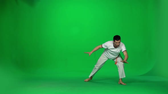 Man Practicing Capoeira on Chroma Key Studio. Slow Motion.