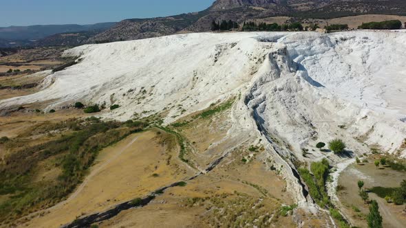 close up of white mineral rich mountain cliffs in Pamukkale Turkey famous for its thermal pools