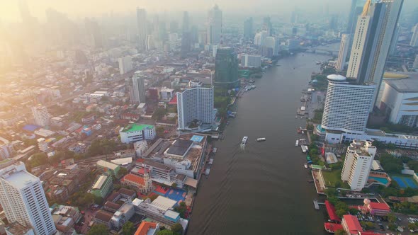 4K : Aerial view over Bangkok city and Chao phraya river. Cinematic drone shot.
