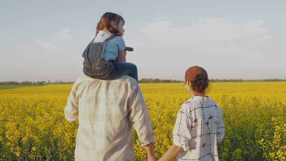 A Family of Farmers in the Field.