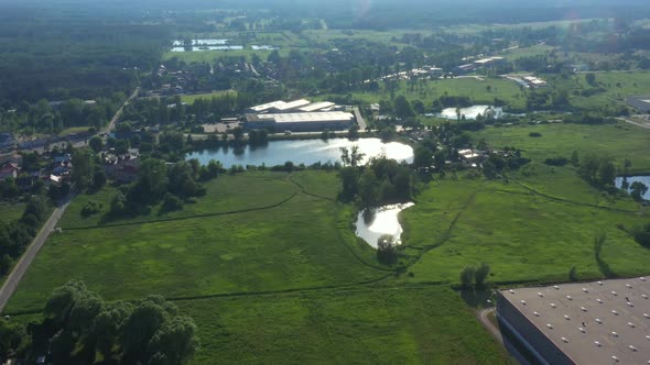 Aerial view of warehouse with trucks.