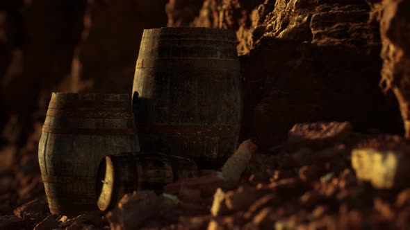 Old Wooden Vintage Wine Barrels Near Stone Wall in Canyon