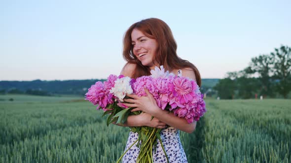 Woman Holding Pink Flowers Peonies Looking Ahead Enjoying Freedom