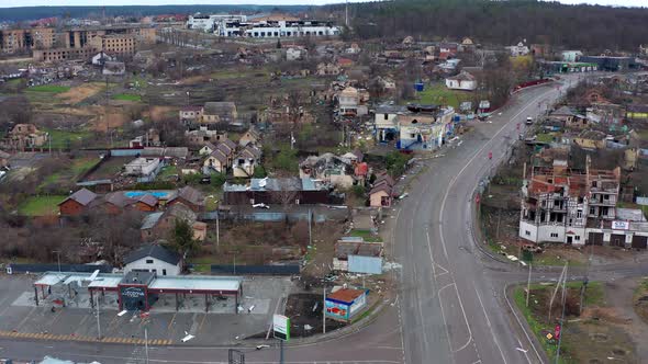 Top view of the road. Aerial view of the destroyed and burnt houses. alt