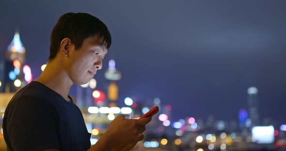 Man use of mobile phone at night