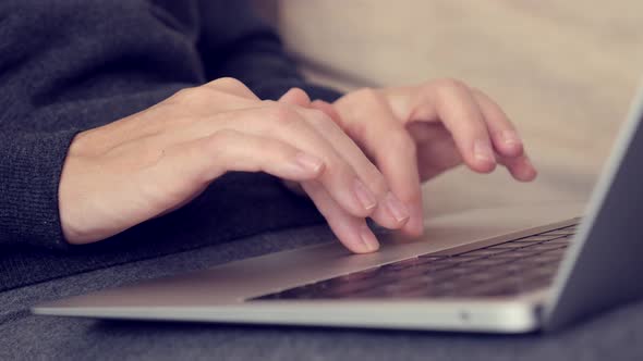 Female hands on laptop touch pad while surfing on Internet 4K video