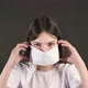 The young woman put on a medical mask. - VideoHive Item for Sale