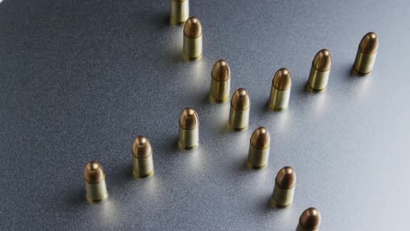 Cinematic rotating shot of bullets on a metallic surface - BULLETS 040