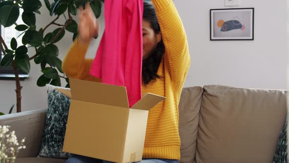 Happy Asian Young Woman with Parcel Box at Home