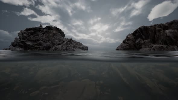 Half Underwater in Northern Sea with Rocks