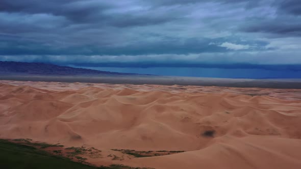 Sand Dunes with Storm Clouds in Gobi Desert