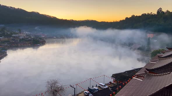 Sunrise with Fog Over Ban Rak Thai Chinese Village Near a Lake in Mae Hong Son Thailand