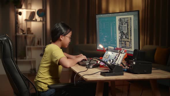 Asian Girl Is Working With Desktop Computer In Home, Display Showing Cad Software, Genius Child
