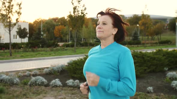 Old Woman Running at Park