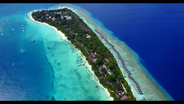 Aerial view scenery of tropical resort beach journey by blue green ocean and bright sand background 