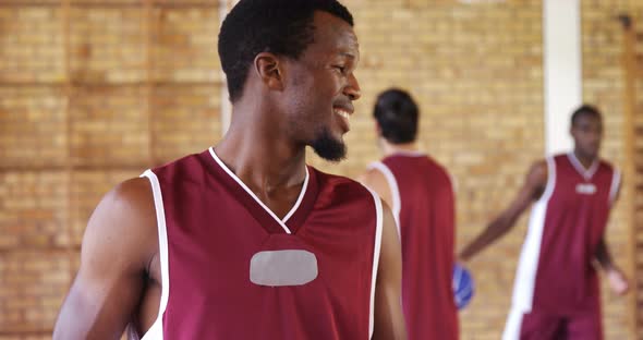 Smiling basketball player holding a basketball