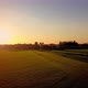 Aerial Cinematic Clip Drone Flying Over a Farm Field During Sunset - VideoHive Item for Sale
