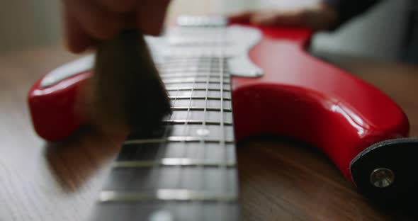 Handmade Guitar - Luthier Applying Lemon Oil Cleaner Conditioner