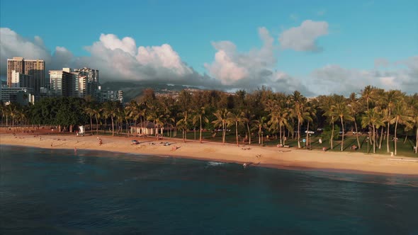 Aerial drone footage of Honolulu, Hawaii. Beautiful real estate, buildings in the city. Palm trees