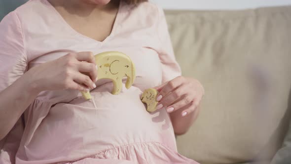 Pregnant Woman Playing Wooden Baby Toys