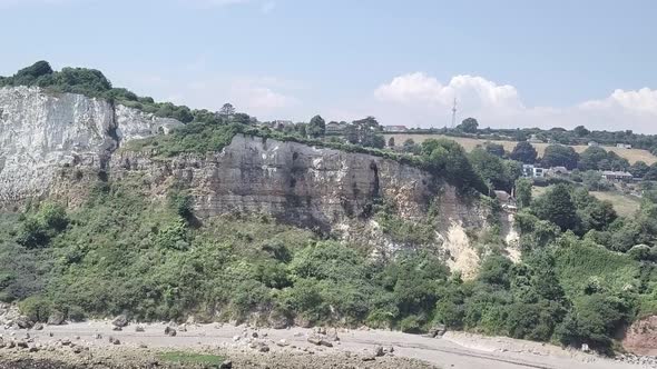 Beautiful chalk cliff on the white sandy beach of Seaton. These cliffs can become dangerous due to l