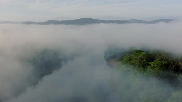 Aerial Drone View of Rainforest River Landscape with Costa Rica Mountains, Beautiful Misty Tropical