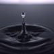Camera follows extreme close-up water drops rippling. Slow Motion. - VideoHive Item for Sale