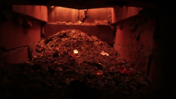 Burning Coals Falling On Ash in stove