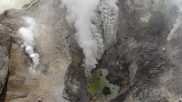 Mutnovsky Volcano Crater with Lake in the Center in Kamchatka Russia