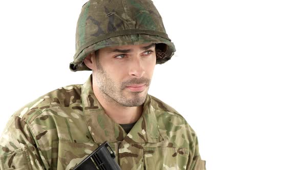 Soldier aiming rifle on white background