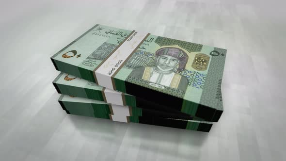 Oman Rial money banknote pile packs