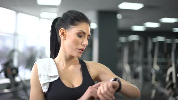 Sport Woman Checking Pulse and Burned Calories in Smartphone, Modern Technology